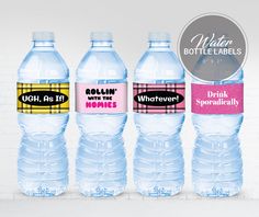 three bottled water bottles with labels on them