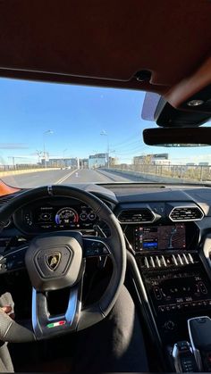 the interior of a car with dashboard and steering wheel view from driver's seat