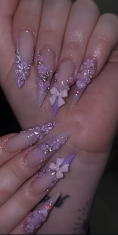 Birthday Nail Inspo Aquarius, Acrylic Stilleto Nail Ideas, Lavender Nails Inspiration, Gel Nail Designs With Charms, Purple Xl Nails, Light Purple Nails With Rhinestones, Pretty Birthday Nails Long, Pastel Purple And Pink Nails, Prom Long Nails