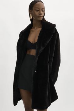 From the timeless silhouette to the updated details, the Linnea faux fur coat is flattering in every way. A notched collar with snap closure accents the neckline and waist pockets add a practical touch. Crafted out of plush faux fur, the Linnea is both stylish and cozy, making it the perfect go-to when the temperature Black Fur Coat Outfit, Black Fur Coat, Black Faux Fur Coat, Pea Coats Women, Coat Outfit, 2024 Style, Christmas Inspo