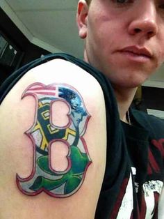 a man with a boston red sox tattoo on his arm