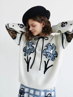 <Size>

 *Unit: cm 







size 

 bust 

 Sleeve Length 

 Length 











F 

 112 

 46 

 58 













 <Material>



 15% wool

 20% Acrylic

 20% nylon

 45% polyester 







 ＜Model wearing＞



 Wearing size



 F size




 Model Dimensions



 Height: 168cm

 Bust: 80cm

 Waist: 60cm

 Hips: 90cm White Winter Sweater With Floral Embroidery, White Long Sleeve Sweater With Floral Embroidery, White Floral Embroidery Winter Sweater, White Floral Embroidery Sweater For Winter, Beige Long Sleeve Sweater With Floral Print, White Floral Embroidered Long-sleeved Sweater, Oversized Floral Print Sweater, Winter White Long Sleeve Sweater For Spring, Cream Sweater With Floral Embroidery For Spring