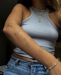 a woman with a tattoo on her arm