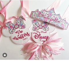 two minnie mouse ears with pink bows on them