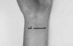 a black and white photo of a person's arm with the words bad memory tattooed on it