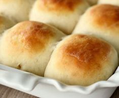 rolls in a white baking dish with the words 30 minute dinner rolls on it's side