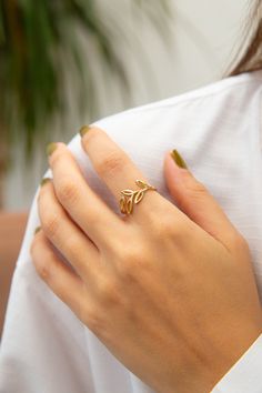 The beauty of nature with our handcrafted olive branch ring, a symbol of peace and harmony. Adorn your finger with our sterling silver olive leaf band, representing the tranquility found in nature. Experience natural elegance with our delicate olive branch design ring in elegant silver. Symbolize peaceful adornment with our jewelry, a sign of inner tranquility and harmony.  Minimalist design meets the charm of sleek style in our olive ring. Evoke feelings of growth and peace with our golden oliv Olive Ring, Olive Branch Jewelry, Olive Branch Design, Olive Branch Ring, Minimal Gold, Symbol Of Peace, Branch Ring, Peace And Serenity, Branch Design