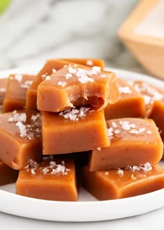 a white plate topped with pieces of caramel fudge