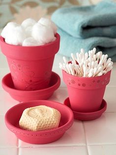 two red cups filled with marshmallows on top of a table