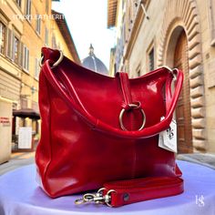 This bag has been made of the best genuine leather by local master crafters of Florence in Italy, designed for women who only accept premium Italian quality and luxury leather bags and modern Italian fashion. . Sizes: Width: 33cm / 13inches Height: 26cm/ 10.3 inches Depth: 12cm/ 4.8 inches . The story of this bag: Once upon a time, in the heart of Florence, Italy, a skilled artisan embarked on a journey to create the epitome of elegance and sophistication: the Florence Leather Bag. Meticulously crafted with the finest materials and an unwavering passion for craftsmanship, this custom leather bag quickly became a symbol of timeless style. Each Florence Leather Bag is a true work of art, designed to capture the essence of individuality and grace. The artisans pour their hearts into handcraft Elegant Red Satchel With Leather Handles, Red Smooth Grain Shoulder Bag For Daily Use, Red Shoulder Bag With Smooth Grain For Daily Use, Red Smooth Grain Top Handle Shoulder Bag, Red Top Handle Shoulder Bag With Smooth Grain, Luxury Smooth Grain Shoulder Bag As Gift, Chic Red Shoulder Bag With Smooth Grain, Modern Red Shoulder Bag With Leather Lining, Elegant Red Shoulder Bag With Leather Lining