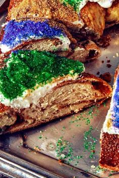 This celebratory king cake features a braided yeast dough with cinnamon sugar that's shaped into a ring then decorated with gold, purple, and green for Mardi Gras.