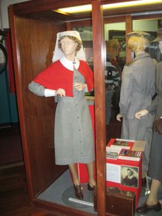 two mannequins dressed in gray and red