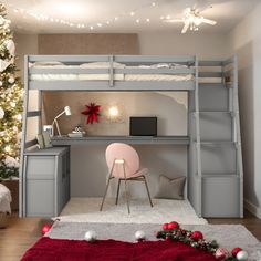 a loft bed with a desk underneath it and christmas decorations on the floor next to it