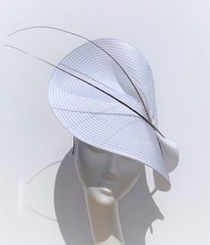 white and gold Royal Ascot Hat The white and gold Royal Ascot Hat will be an amazing accessory to compliment your outfit. The colours can easily pick the colours you would be wearing. The white and gold hat will fit the average head size. It's made from a fabric-covered headband attached to the white colour polybraid saucer disc on which sits gold colour feathers.  To secure your fascinator there is a comb inside the hat attached to the headband, so the fascinator sits very steady on your head. Luxury White Feather Fascinator, Elegant White High Crown Mini Hat, Adjustable White Top Hat With Short Brim, White Adjustable Top Hat With Short Brim, Elegant White Hat With Structured Crown, White High Crown Top Hat For Party, Formal White High Crown Top Hat, White Fitted High Crown Hat, Elegant White Hats For Spring