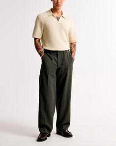 Our classic pant in a cleaned up silhouette and everyday menswear fabric. Fits wide through the leg and sits higher at the ankle. Features a shorter inseam designed to hit at the ankle and give a cleaner visual. For a standard visual, choose a longer inseam. Green Trousers Men Outfits, Olive Green Mens Outfits, Court Outfit Men, Green And Black Outfits Men, Men’s Wedding Guest Attire, Pleated Pants Outfit Men, Men’s Trousers, Wide Leg Pants Outfit Men, Green Trousers Outfit Men