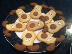 cookies decorated to look like teddy bears on a plate