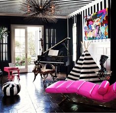 a living room filled with furniture and a piano