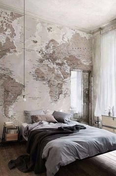 a bedroom with a map on the wall