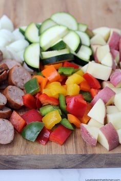 chopped vegetables and meat on a cutting board