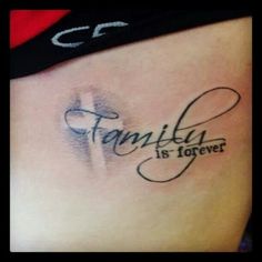 the back of a woman's stomach with an inscription that reads, strength is forever