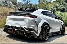 the rear end of a white sports car