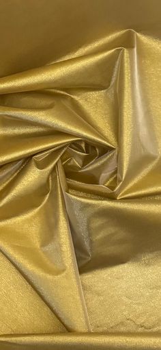 a close up view of a shiny gold cloth