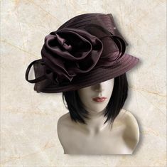 Beautiful, elegant all seasons ladies hat.  Satin braid with a matching satin bow. Uneven brim and crown. Ideal for Church, weddings, tea parties OSFA Elegant Burgundy Brimmed Hat, Elegant Wide Brim Burgundy Hat, Elegant Burgundy Wide Brim Hat, Adjustable Brown Hats For Evening, Elegant Brown Fedora Hat, Brown Brimmed Evening Hat, Evening Brown Brimmed Hat, Elegant Brown Cloche Hat With Curved Brim, Adjustable Brown Hat Fascinator