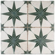 an image of a star pattern in white and green colors on the tile flooring