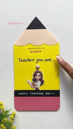 someone is holding up a teacher's day card