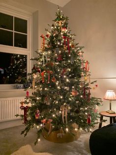 a decorated christmas tree in a living room