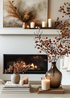 a living room filled with furniture and a fire place in front of a painting on the wall