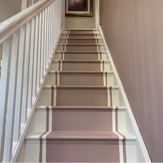 the stairs are painted in shades of pink and white