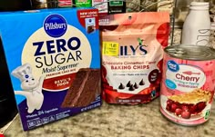 some food items are sitting on a counter top next to a bag of zero sugar and two bags of baking chips