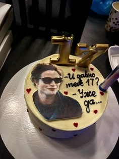 a birthday cake with a photo of the actor on it and an i love you message