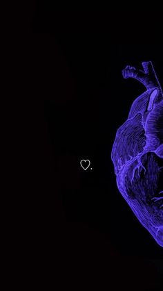 a blue heart shaped object in the dark