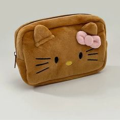 Hello Kitty Makeup Bag Soft And Fluffy It Comes In 2 Colors Brown And White You Choose Which One U Want Cute Cheap Hello Kitty Bags, Rectangular Hello Kitty Everyday Bag, Brown Hello Kitty, Hello Kitty Purse Brown, Hello Kitty School Pouch Bag, Hello Kitty Makeup Bag, Hello Kitty Cute Pouch Bag, Kitty Makeup, Hello Kitty Makeup