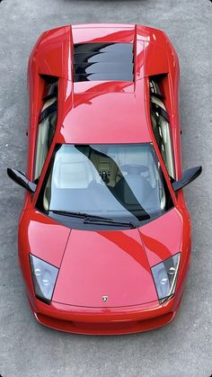 an overhead view of a red sports car