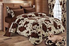 a brown and white dog laying on top of a bed in a room with wooden walls