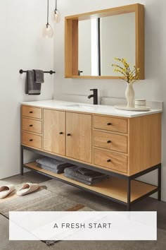 a bathroom vanity with a mirror, sink and shoes on the floor in front of it