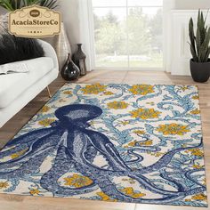 an octopus rug is on the floor in front of a couch and potted plant