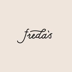 the word freda's written in cursive writing on a beige background