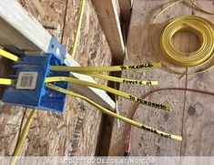 some yellow wires are connected to an electrical outlet and plugged into a wall in the process of being installed