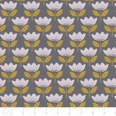 a gray and yellow flower pattern on a grey background, with the ruler in front of it