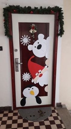 the door is decorated with snowmen, polar bears and penguines for christmas time