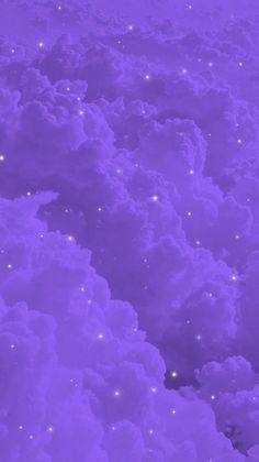 the sky is filled with lots of clouds and stars in purple hued lightening