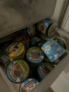 an open refrigerator filled with lots of ice cream