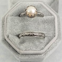 Timeless and classic, this vintage-inspired pearl engagement ring and floral wedding band set are reminiscent of the Edwardian era when fine metalwork was designed with intricate details and delicate settings that were fashioned to resemble the look of fine lace.Each ring is handmade specifically for you in the size you choose using recycled sterling silver. The Edwardian-inspired pearl engagement ring holds a luminous 8-8.5mm cultured creamy white freshwater pearl in a filigree heart-crown sett Pearl Wedding Set Ring, Vintage Wedding Rings 1920s Silver, Goth Wedding Rings Matching, Pearl Stone Ring, Silver Antique Rings, Vintage Wedding Rings Pearl, Silver Vintage Ring, Vintage Bridal Set, Cottagecore Wedding Ring Silver