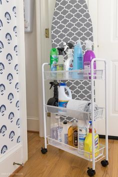 a bathroom shelf with cleaning products on it