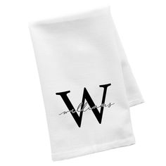 two white napkins with the letter w on them