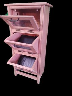 a wooden cabinet with three drawers and one door open to show the inside of it